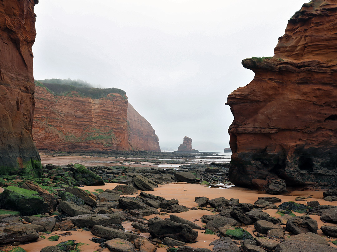 Boulders, sand and cliffs