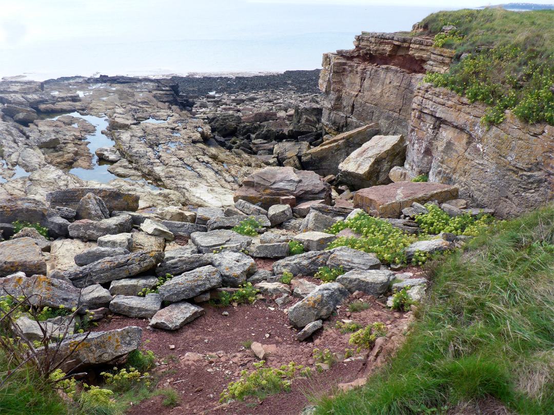 Boulders below the cliffs