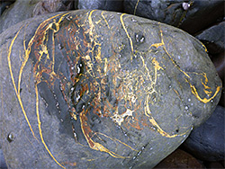 Boulder with yellow veins