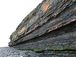 Dark-coloured cliff