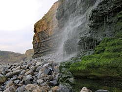 Pebbles below the waterfall