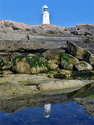 Lighthouse and its reflection