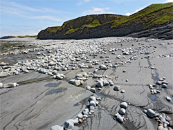 Pebbles on flat rocks