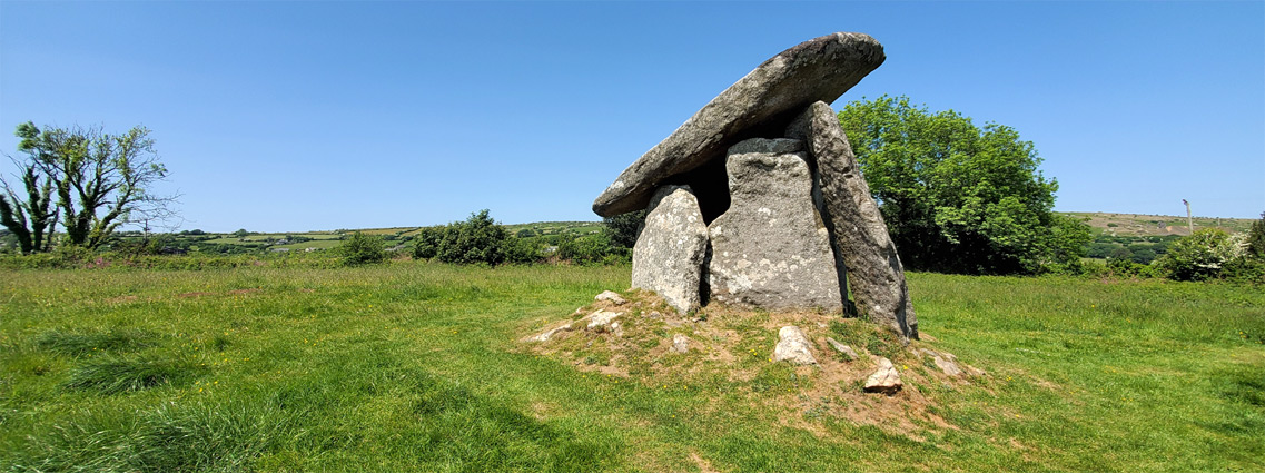 Trethevy Quoit, surrounded by a grassy field