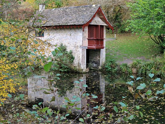 The boathouse and its reflection, Middle Pond